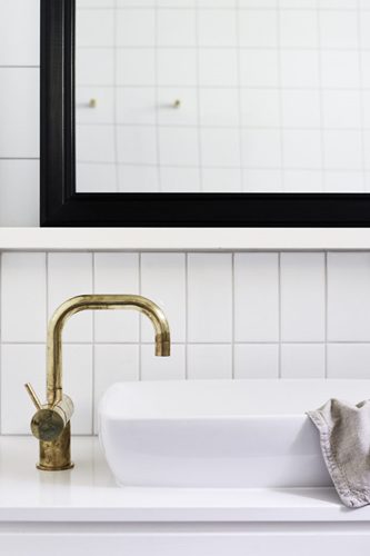 Vanity with aged brass tapware in The Bower Suites, The Bower Byron Bay