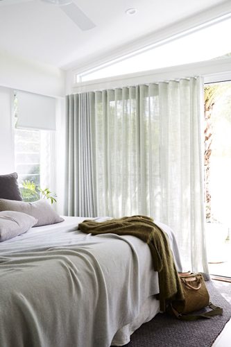 Sunlit bedroom at The Chalet, Byron Beach Abodes