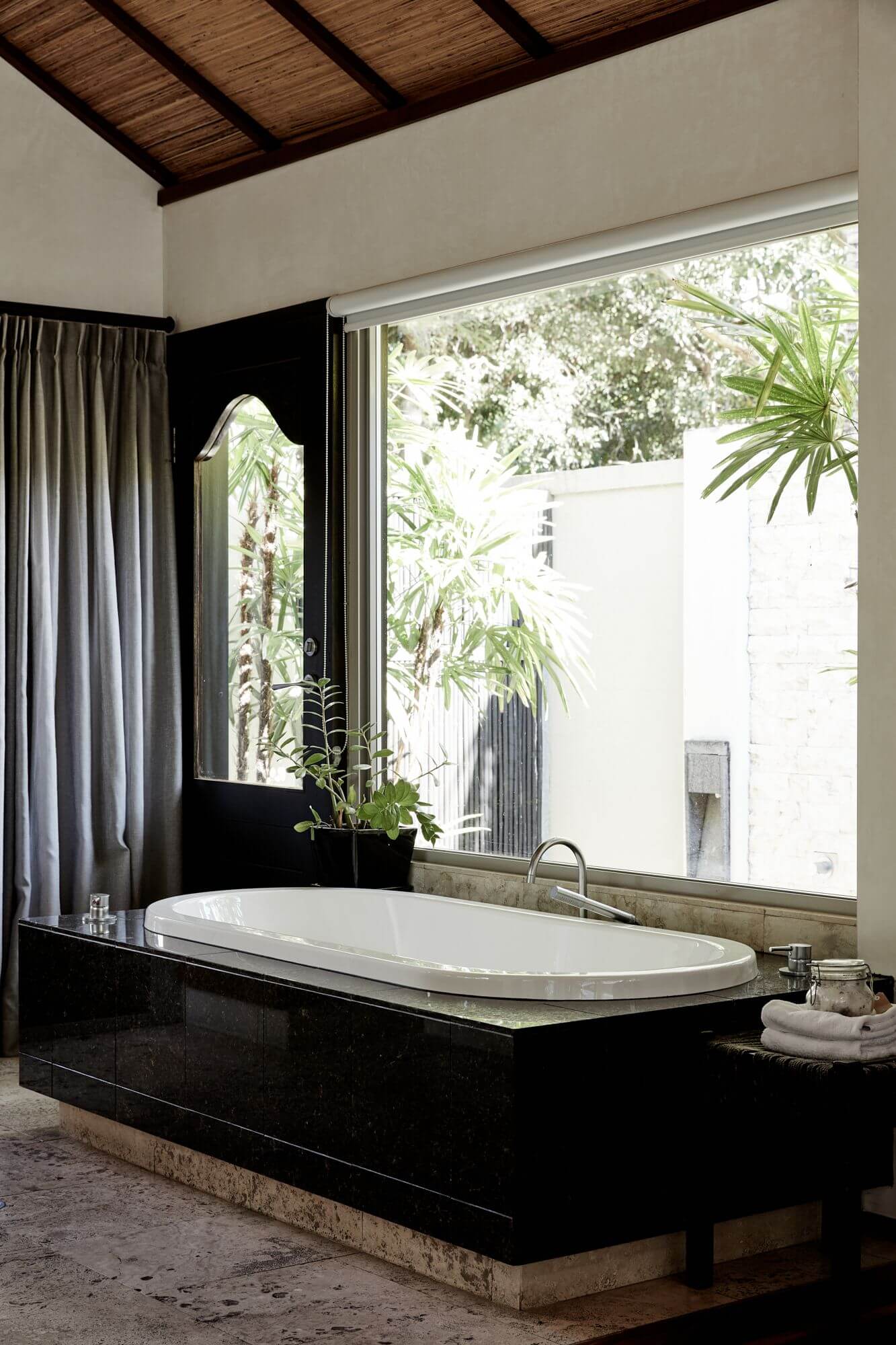 Master ensuite overlooking the private courtyard with outdoor shower at The Villas of Byron