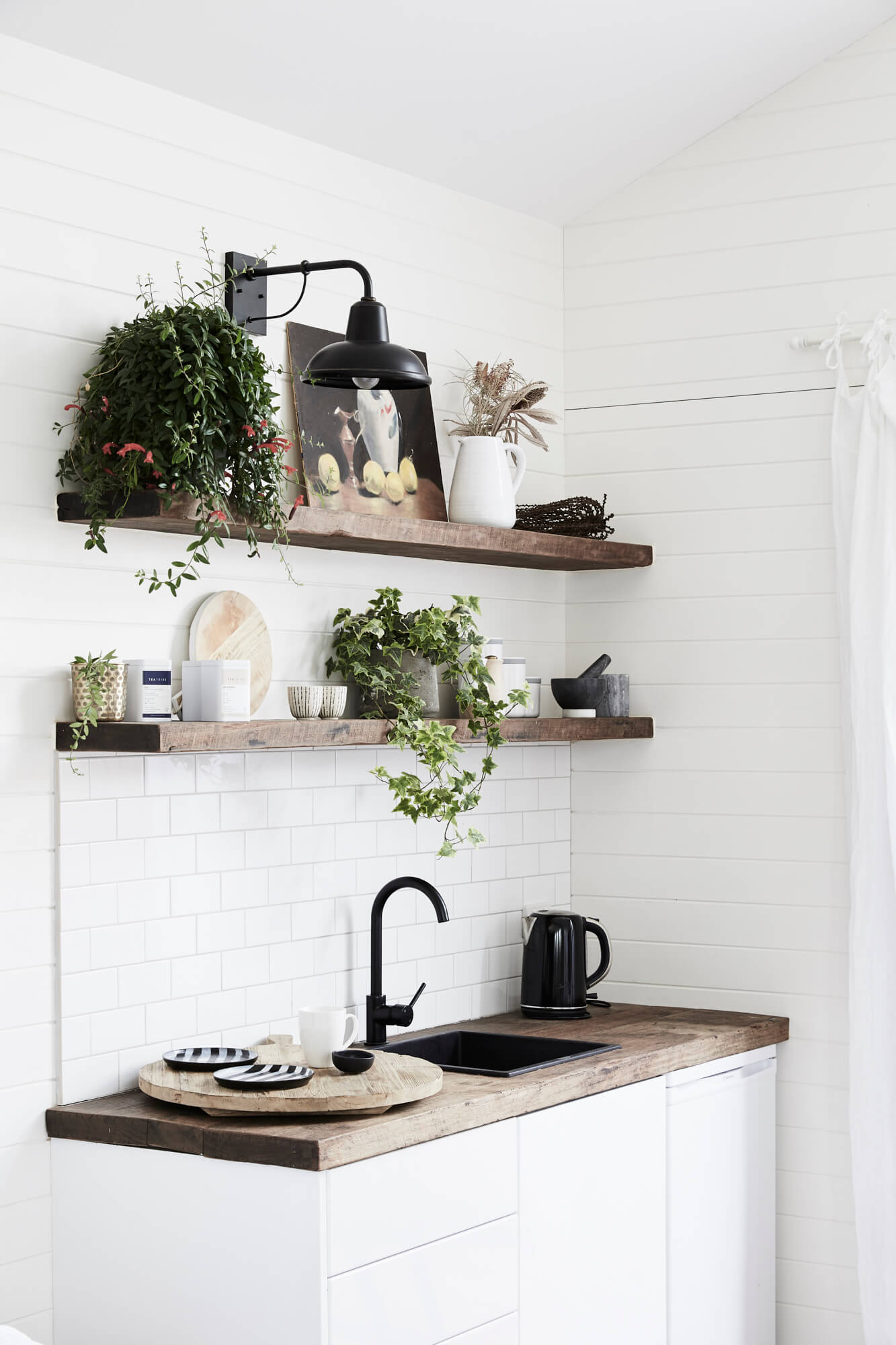 Open timber shelving in the kitchenette at the Bower Barn, The Bower Byron Bay hotel