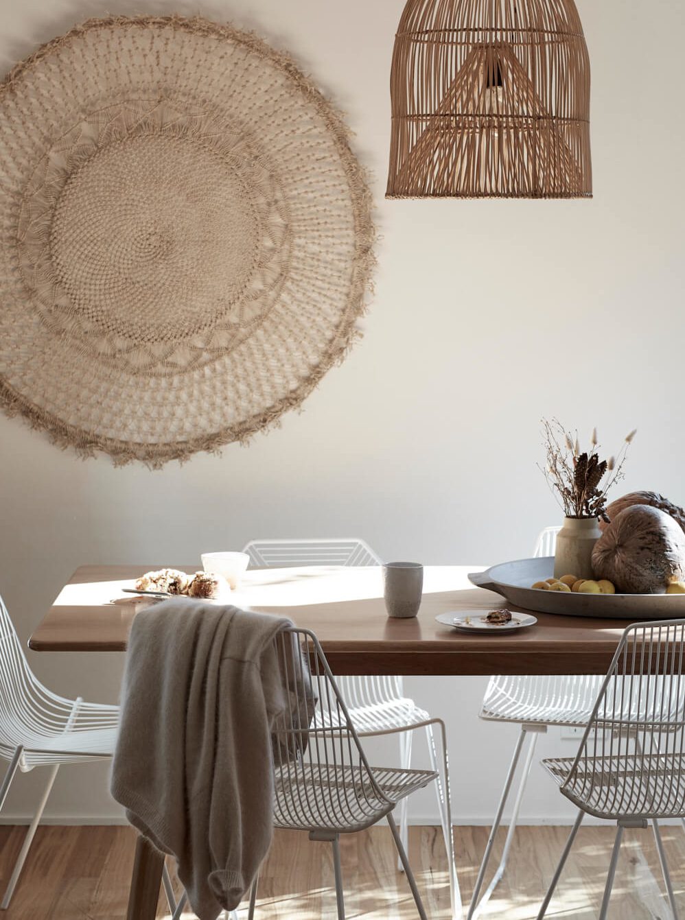 Hand-woven wall mandala above the dining table at Bower House, The Bower Byron Bay
