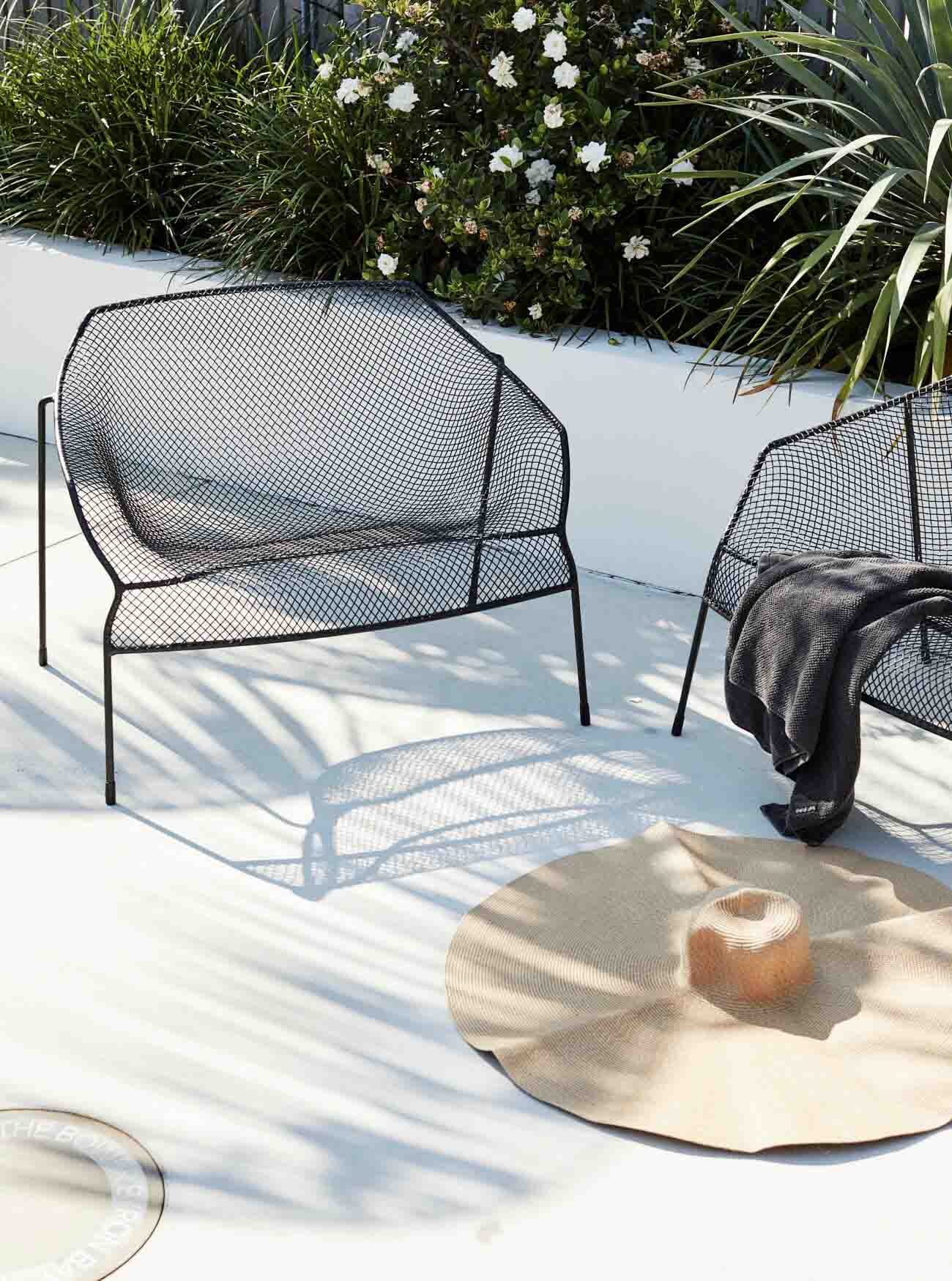 Black metal Eco Outdoor armchairs at The Bower Byron Bay