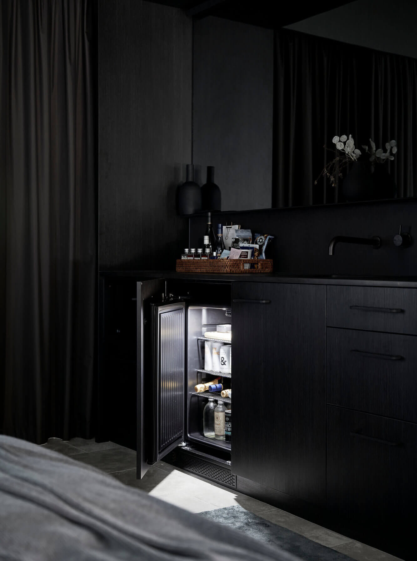 Gourmet mini-bar built into custom black joinery at the Deluxe King Rooms at The Bower Byron Bay hotel