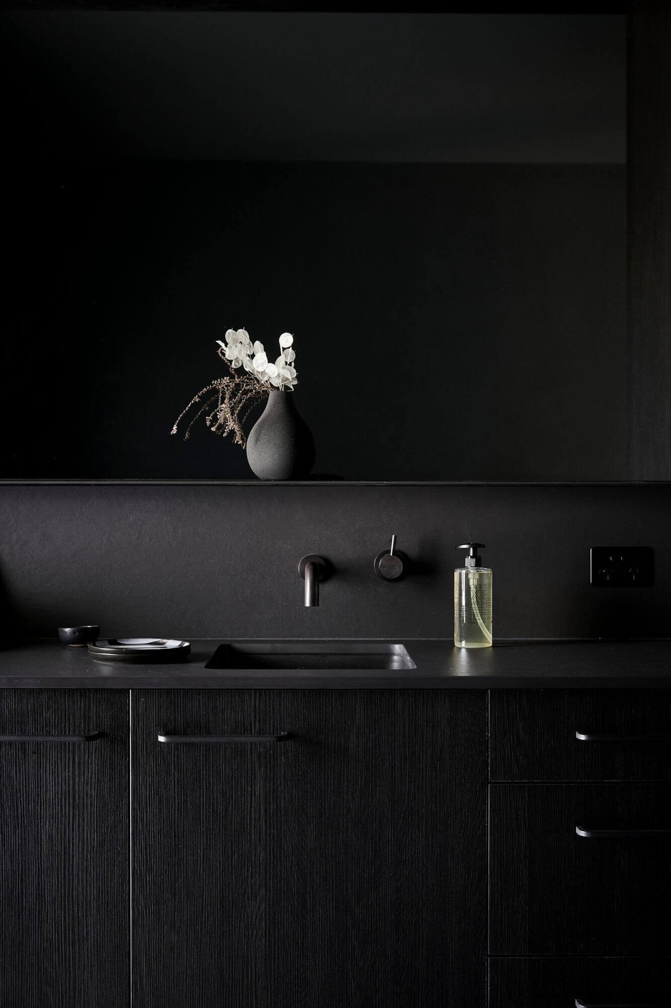 All black kitchenette at the Deluxe King Rooms at The Bower Byron Bay hotel